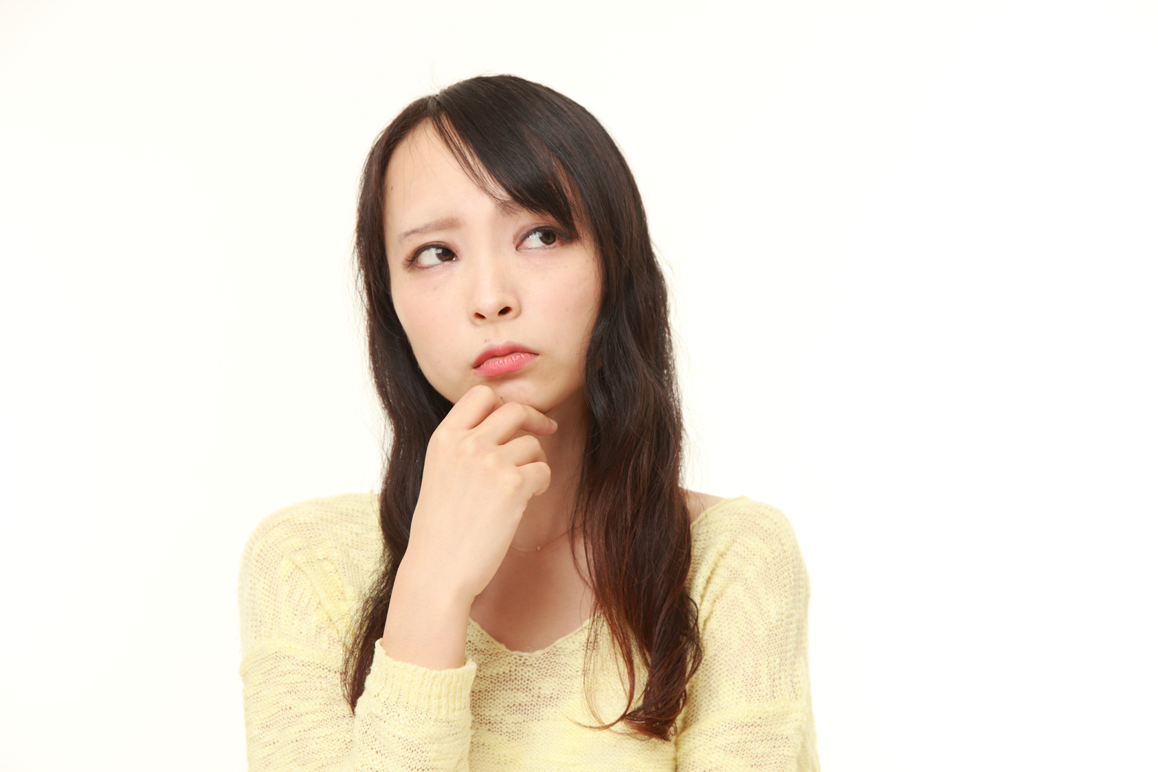 young Japanese woman worries about something